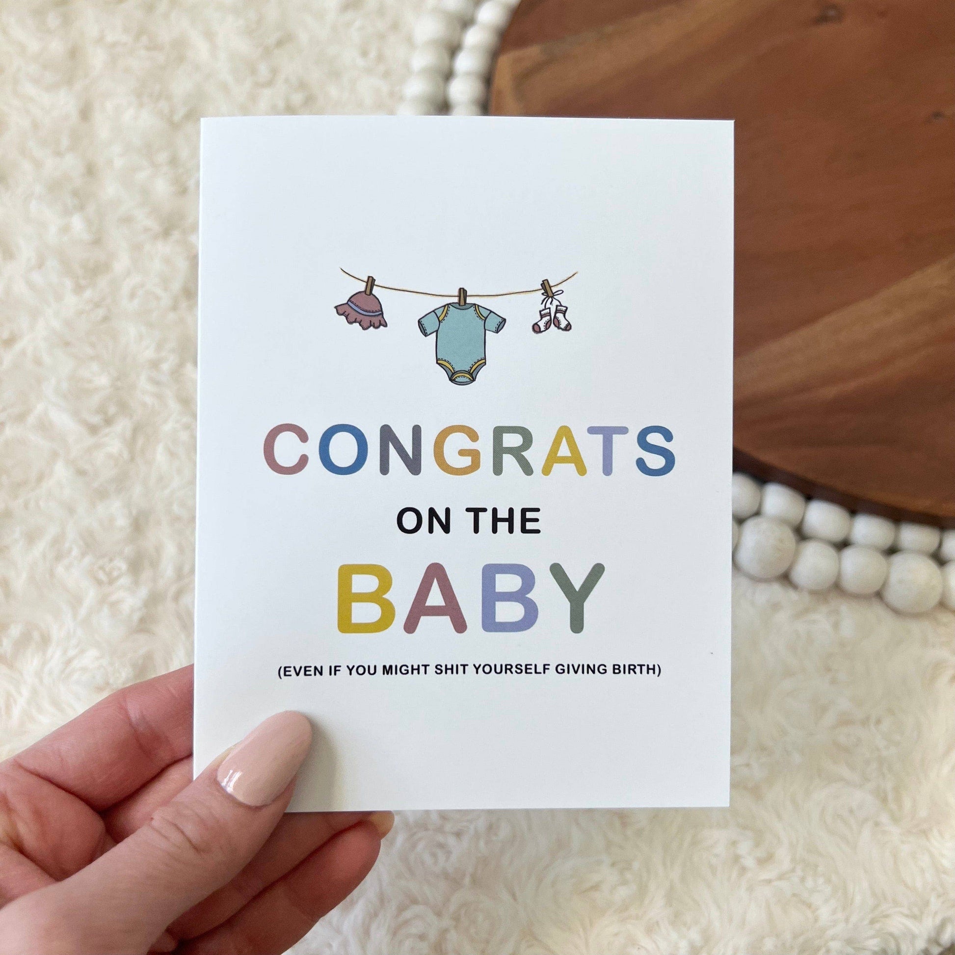 Congrats Baby clothes line greeting card front 