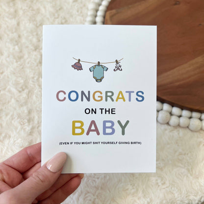 Congrats Baby clothes line greeting card front 